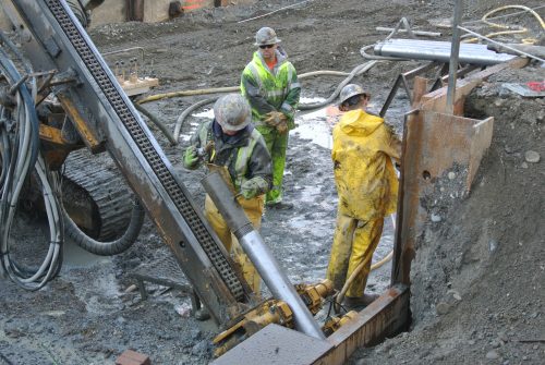 Photo of people at work installing a shoring wall